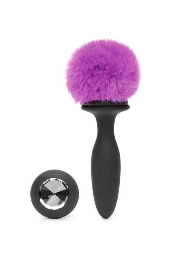 Plug anale vibrante in silicone di colore nero con ponpon viola e gemma